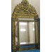 Latoen koper  (ca. 1930)
Kantige halspiegel met geslepen glas in vergulde ornamentenlijst met kuif